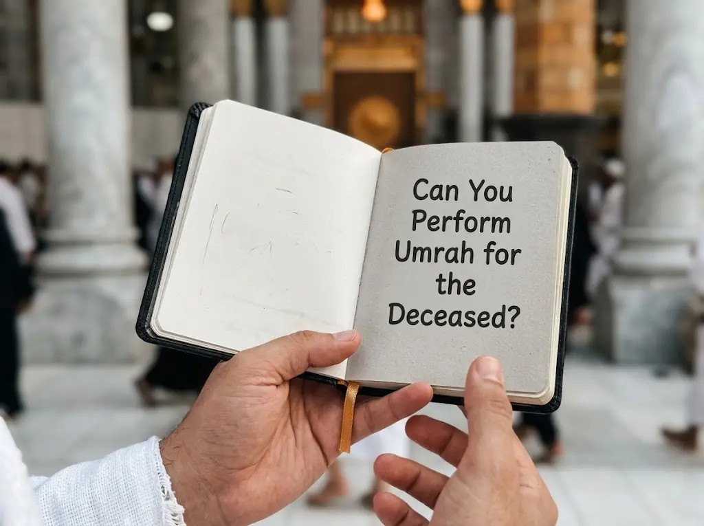 A persons hands holding a notebook asking Can You Perform Umrah for the Deceased?